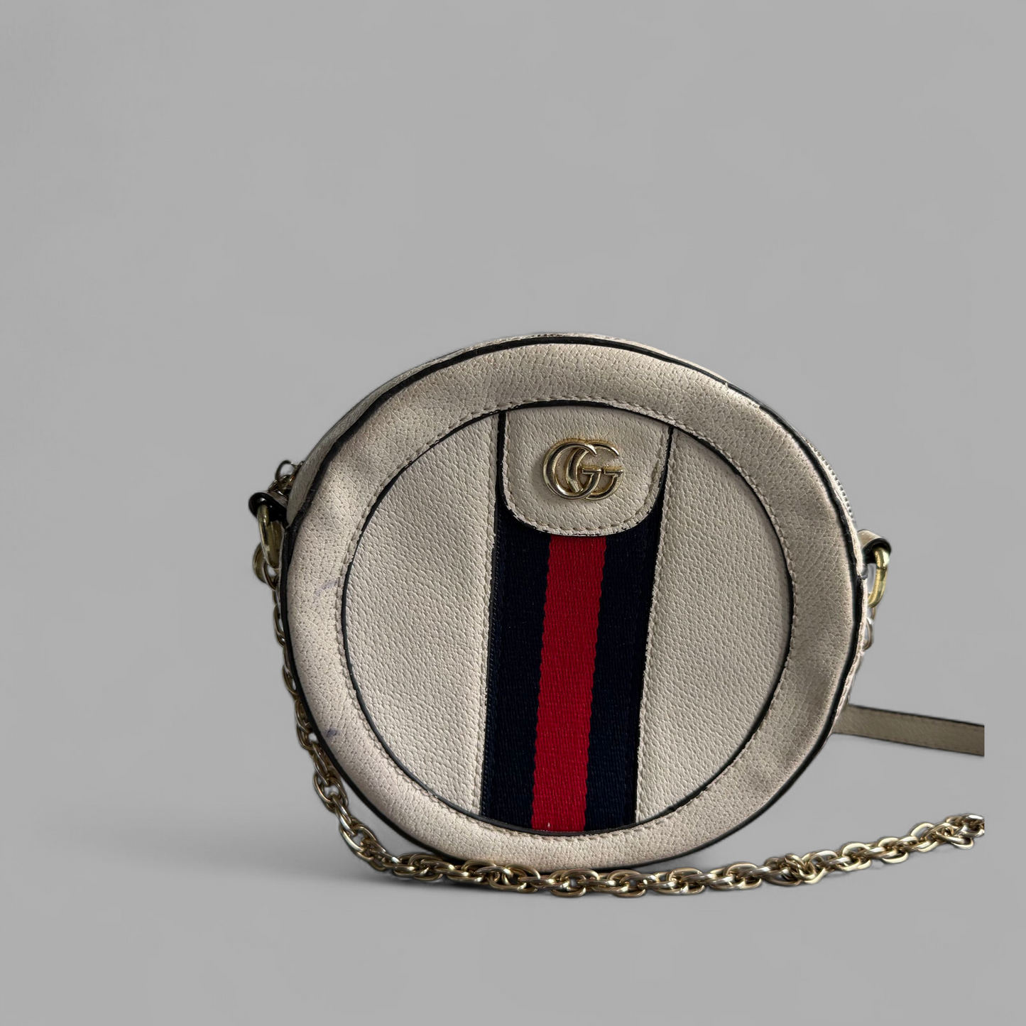 Stunning round beige cross body with chain strap.