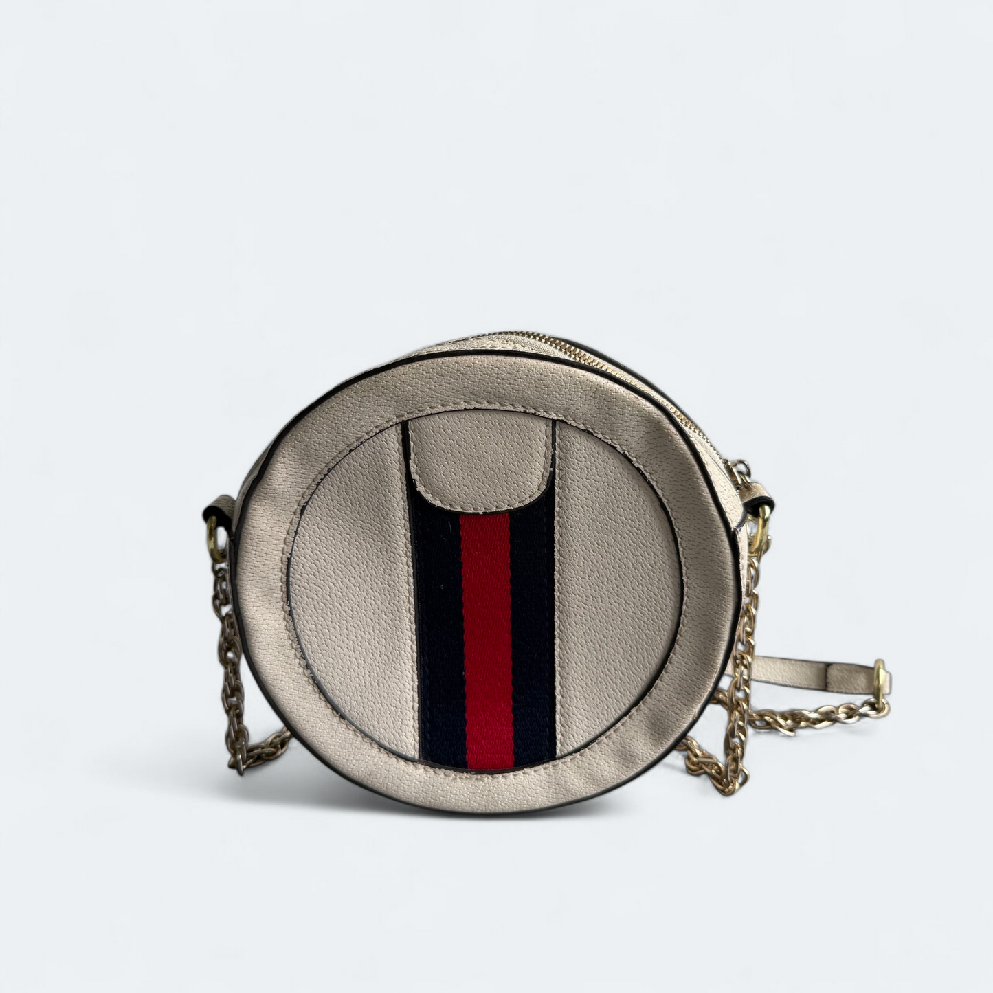 Stunning round beige cross body with chain strap.
